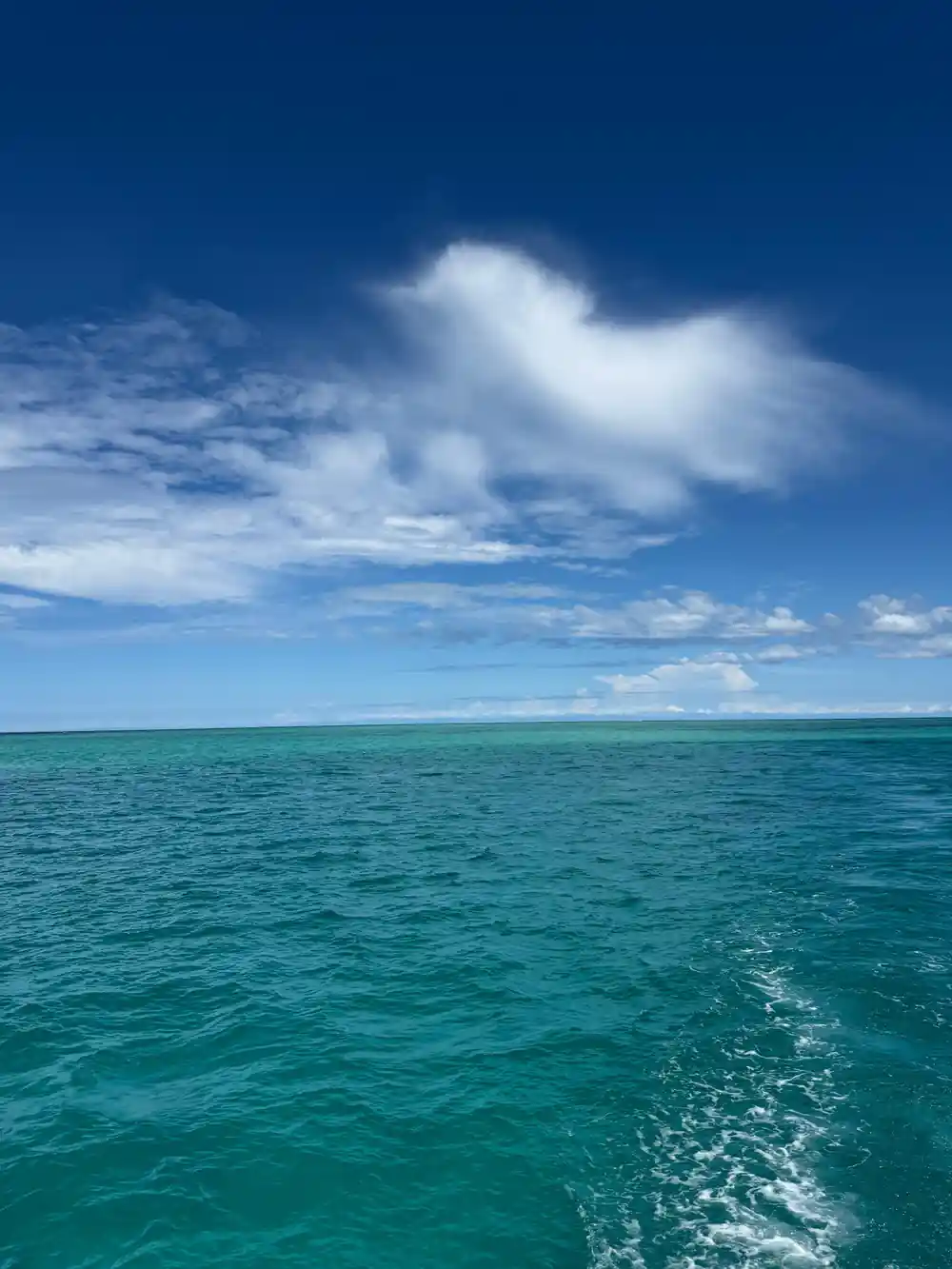 Cloud building over open reef water