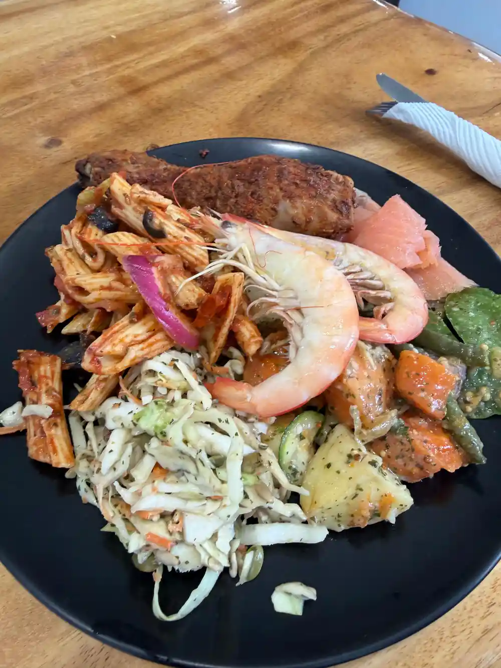 A lunch plate of prawns, seafood, salad and vegetables