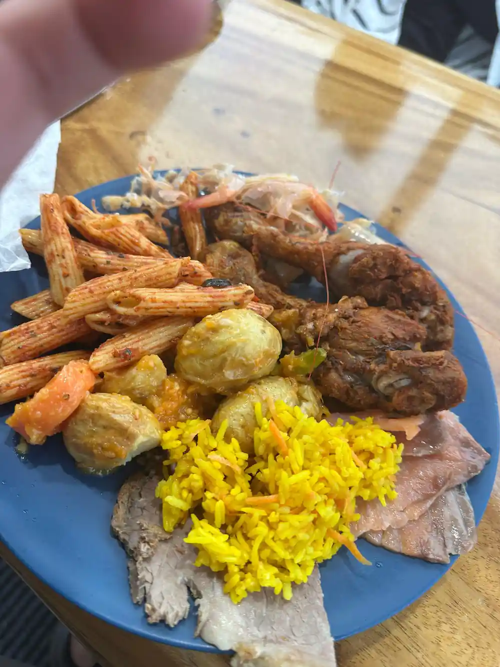 A plate of prawns, rice, meats and salad from the buffet lunch